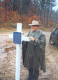 Jim Cougle with Hare's memorial cross and plaque.